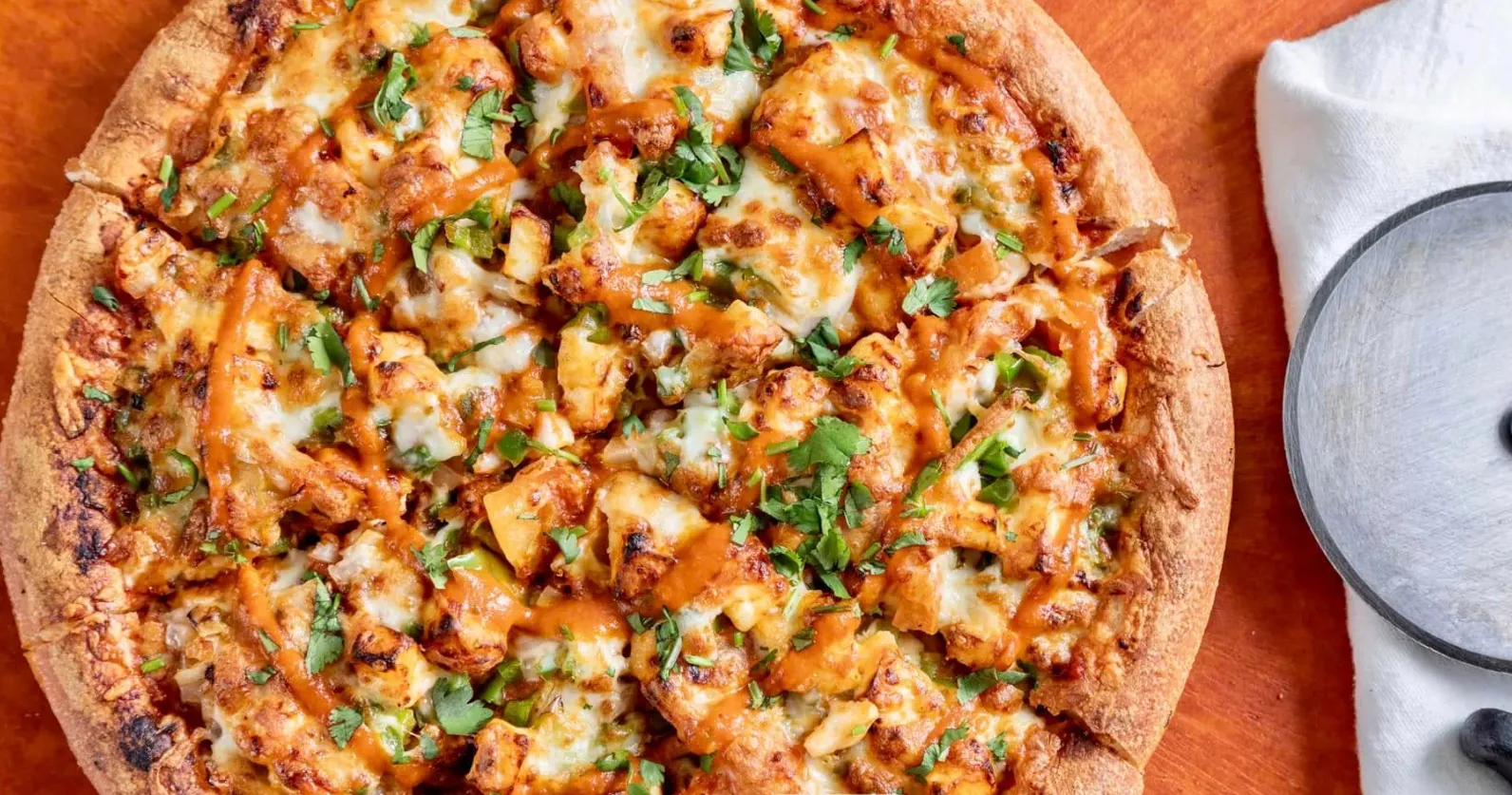 Select Pizza's signature Indian-Punjabi style pizzas in Calgary NE